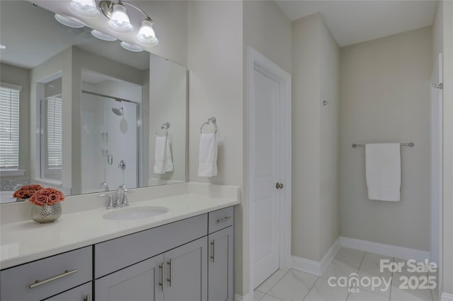 bathroom with tile patterned floors, a shower with door, and vanity