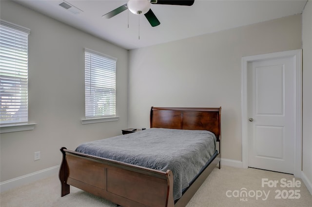 bedroom with ceiling fan and light colored carpet