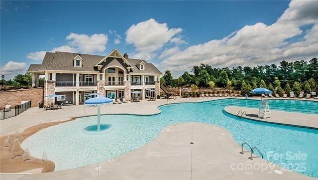 view of swimming pool with a patio area