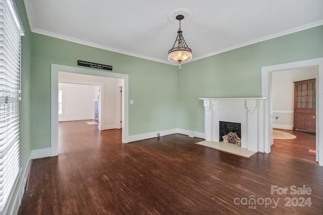 unfurnished living room featuring ornamental molding and dark wood-type flooring