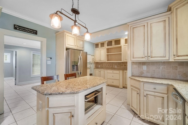 kitchen featuring pendant lighting, ornamental molding, tasteful backsplash, a kitchen island, and appliances with stainless steel finishes