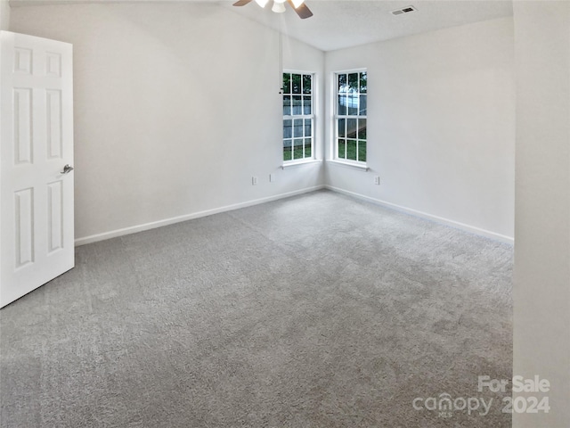 unfurnished room featuring carpet and ceiling fan