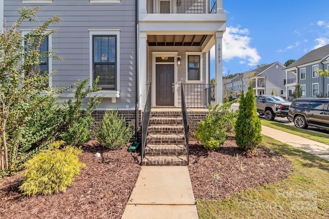 10193 Meeting House Dr NW, Huntersville, NC 28078 - property entrance with a balcony and a residential view