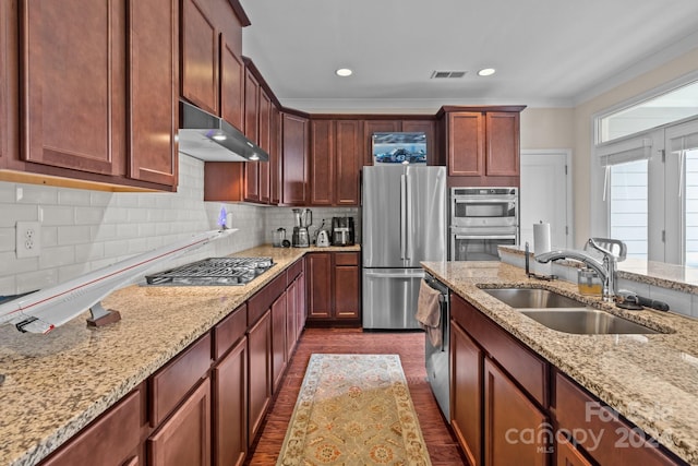 10193 Meeting House Dr NW, Huntersville, NC 28078 - kitchen with a sink, under cabinet range hood, stainless steel appliances, decorative backsplash, and ornamental molding