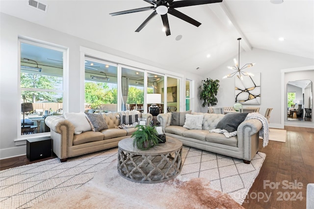 living room with hardwood / wood-style flooring, vaulted ceiling with beams, and ceiling fan with notable chandelier