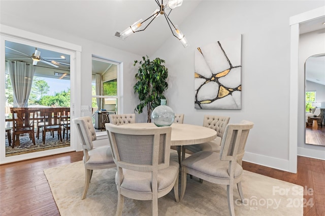 dining room with dark wood-type flooring, ceiling fan, and lofted ceiling