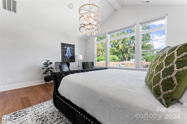 bedroom with a notable chandelier, lofted ceiling with beams, multiple windows, and hardwood / wood-style flooring