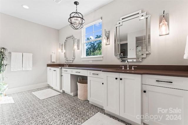 bathroom featuring vanity and an inviting chandelier