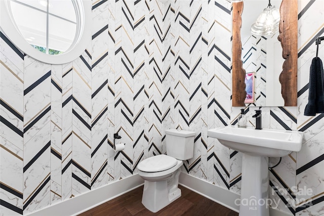 bathroom featuring toilet and hardwood / wood-style floors