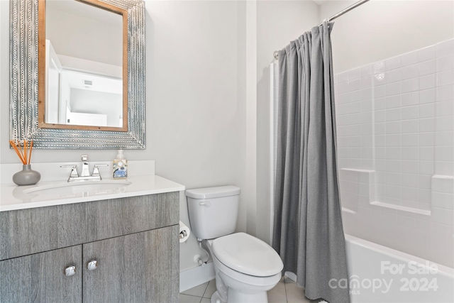 full bathroom featuring toilet, vanity, shower / bath combination with curtain, and tile patterned flooring