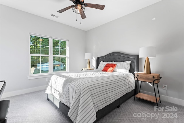 carpeted bedroom with ceiling fan