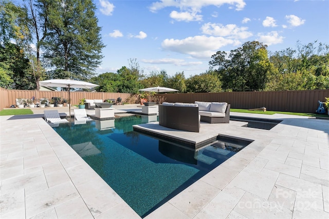 view of pool featuring a patio area and outdoor lounge area