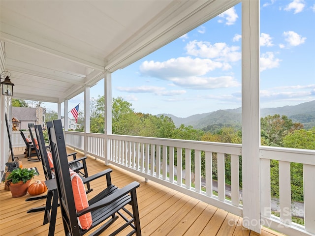 wooden terrace with a mountain view