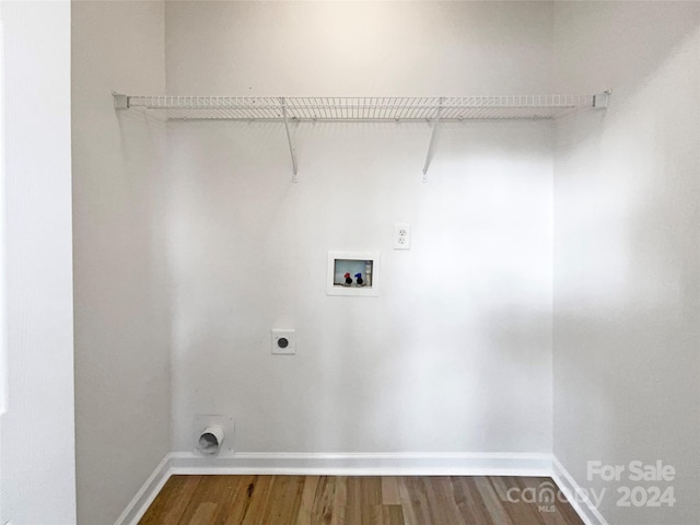 laundry area featuring hookup for a washing machine, hardwood / wood-style flooring, and electric dryer hookup