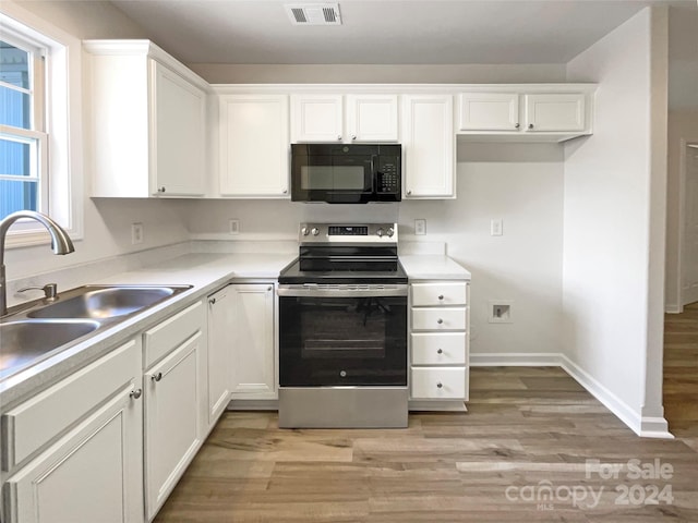 kitchen with white cabinetry, electric stove, light hardwood / wood-style flooring, and sink