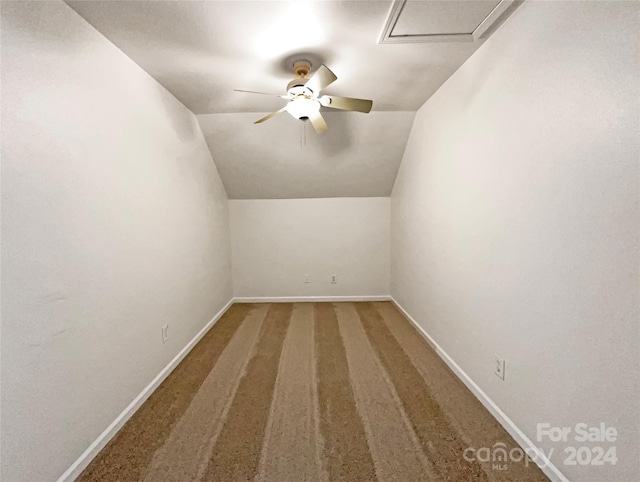 bonus room featuring carpet floors, vaulted ceiling, and ceiling fan