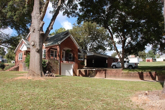 view of side of property with a lawn and a garage