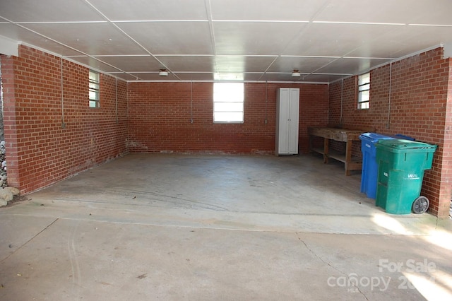 basement with brick wall