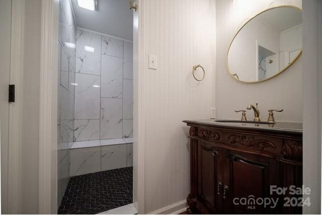 bathroom featuring vanity and a tile shower