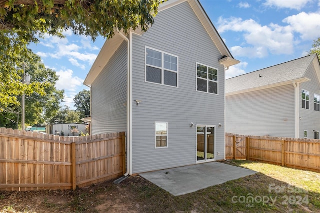 rear view of property featuring a patio area