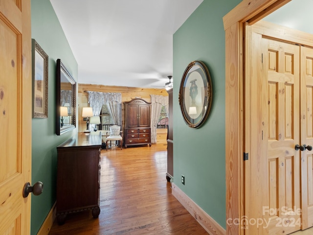 corridor featuring hardwood / wood-style floors