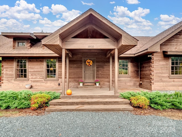 property entrance featuring covered porch