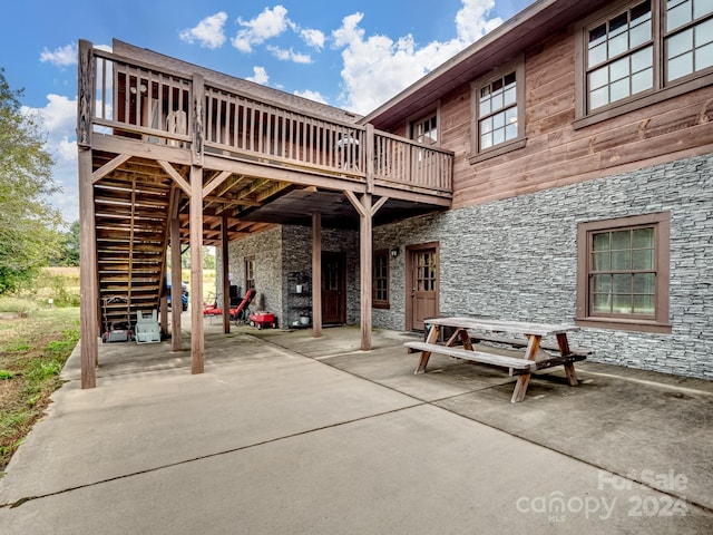 view of patio with a wooden deck