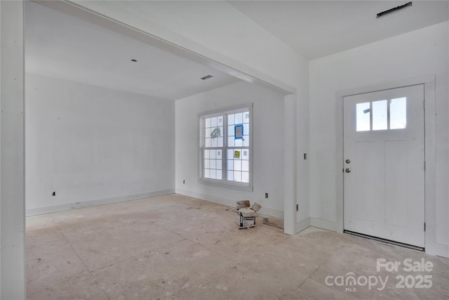 foyer entrance featuring visible vents and baseboards