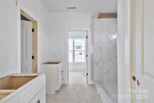 bathroom with concrete floors