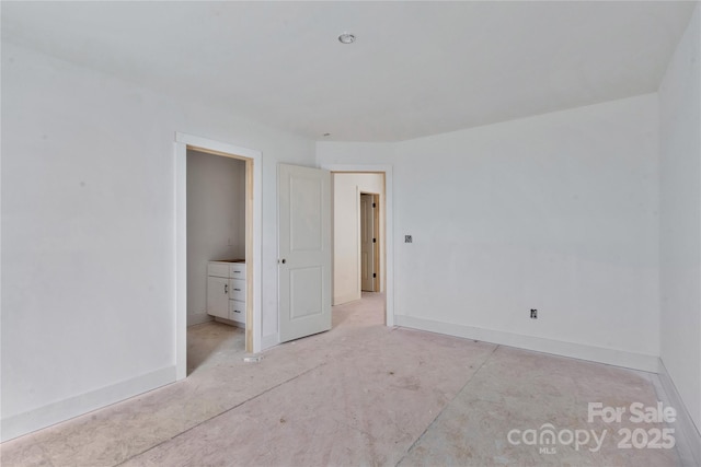 unfurnished bedroom featuring baseboards