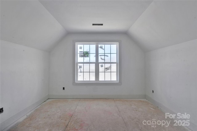 bonus room featuring visible vents and vaulted ceiling