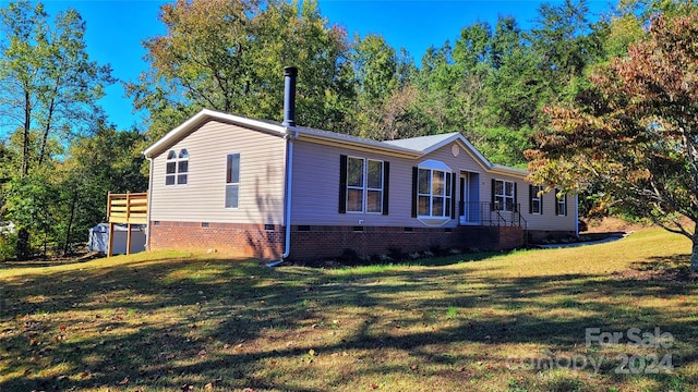 view of property exterior featuring a lawn