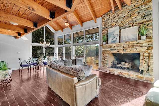 living room with beamed ceiling, wood ceiling, a fireplace, and high vaulted ceiling