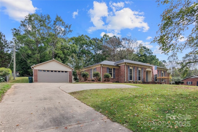 ranch-style home featuring a garage and a front lawn