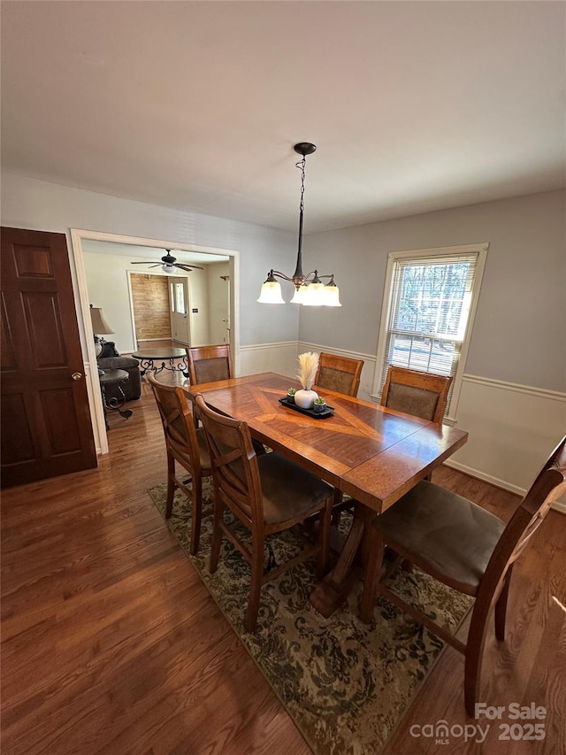 dining room featuring dark wood-type flooring and ceiling fan