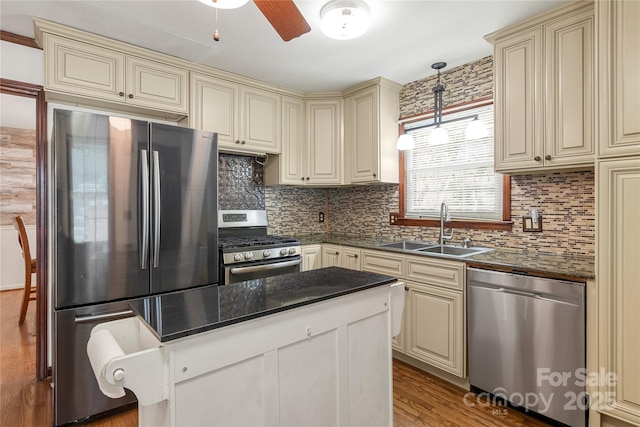 kitchen featuring sink, cream cabinetry, and appliances with stainless steel finishes