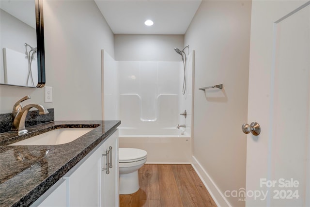 full bathroom featuring vanity, shower / bath combination, toilet, and hardwood / wood-style flooring