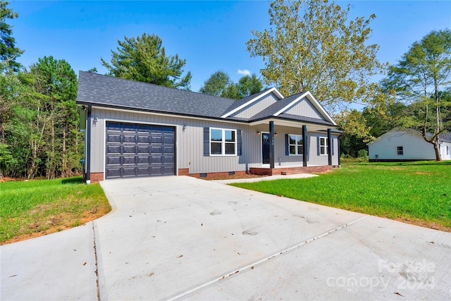 single story home featuring a front yard and a garage