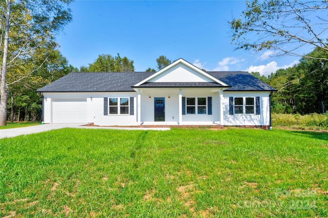 107 Falls St, Lawndale, NC 28090 - view of front of property with a front yard, concrete driveway, a garage, and covered porch