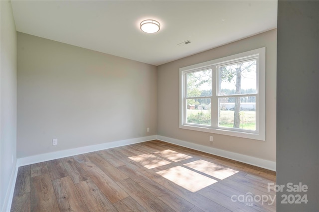 empty room with light wood-type flooring