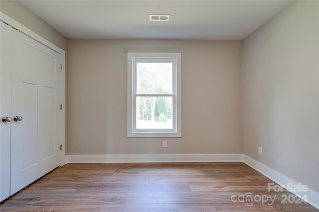 spare room featuring light wood-type flooring