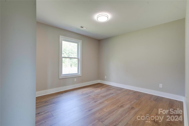 unfurnished room featuring light wood-type flooring