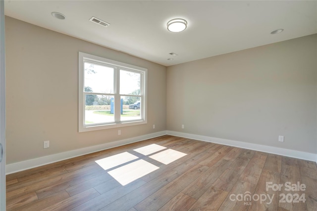 spare room featuring light wood-type flooring