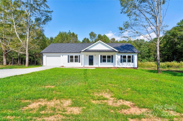 view of front facade with a front yard and a garage