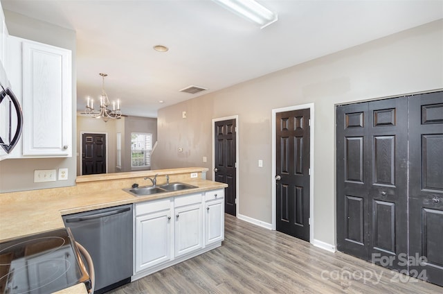 kitchen featuring light wood-type flooring, dishwasher, sink, white cabinetry, and hanging light fixtures