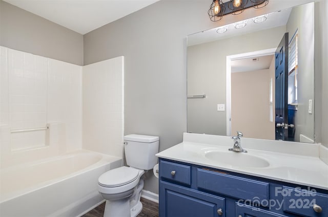 full bathroom featuring wood-type flooring, vanity, toilet, and shower / bathing tub combination