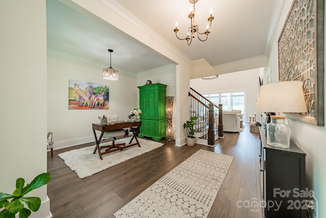 interior space with ornamental molding, a notable chandelier, and dark hardwood / wood-style flooring