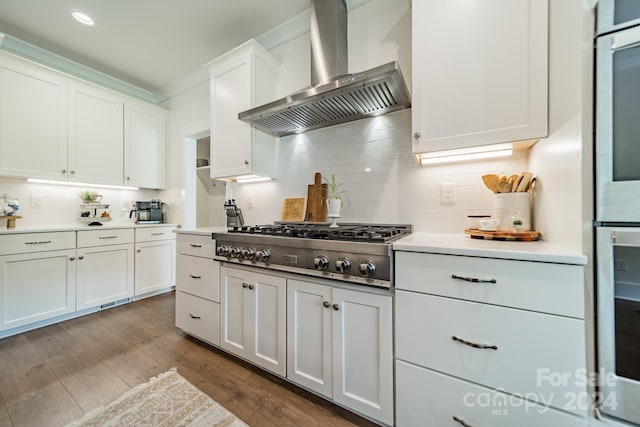 540 Kenway Loop, Mooresville, NC 28117 - kitchen with wall chimney range hood, appliances with stainless steel finishes, decorative backsplash, white cabinets, and light countertops