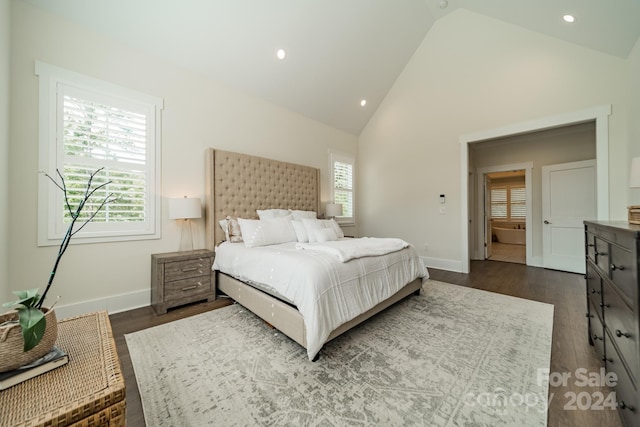 bedroom with dark hardwood / wood-style floors and high vaulted ceiling