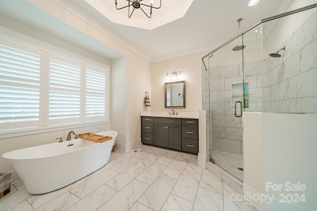 bathroom featuring vanity, crown molding, and separate shower and tub